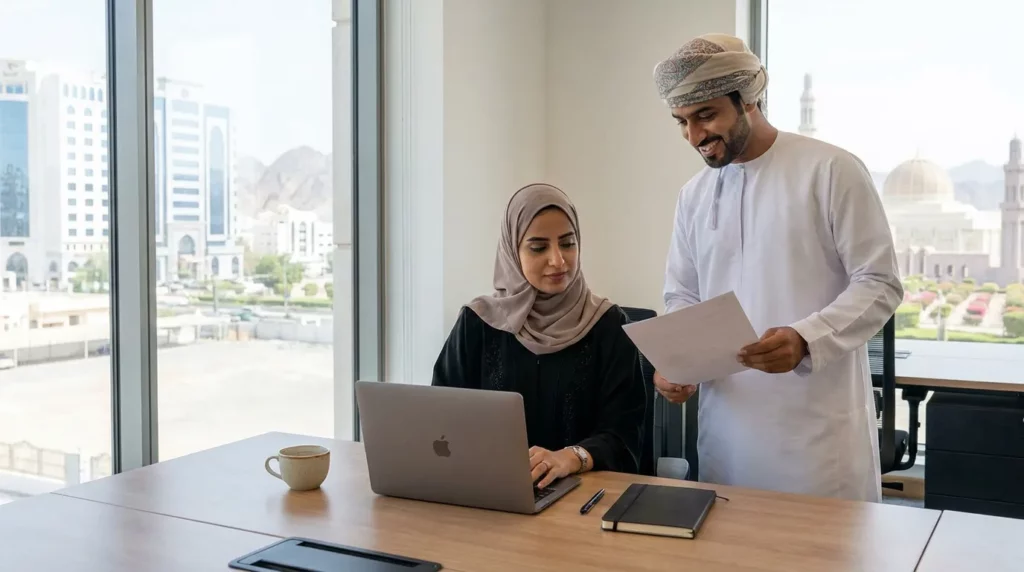 Déménager à Oman un couple travaillant dans un bureau